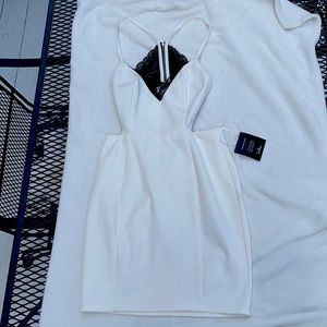 Lulus size small bodycon white dress with black lace.